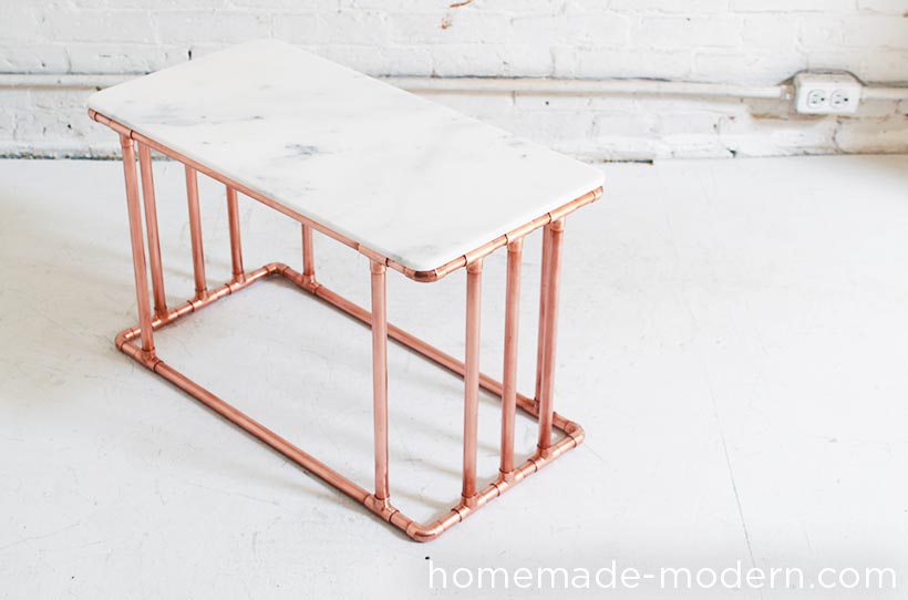 Learn how to make this DIY Copper and Marble Coffee Table and many other DIY modern furniture projects on HomeMade-Modern.com. This DIY Modern Table is made out of ½” copper pipes and Marble tiles and works well as a coffee table or nightstand.