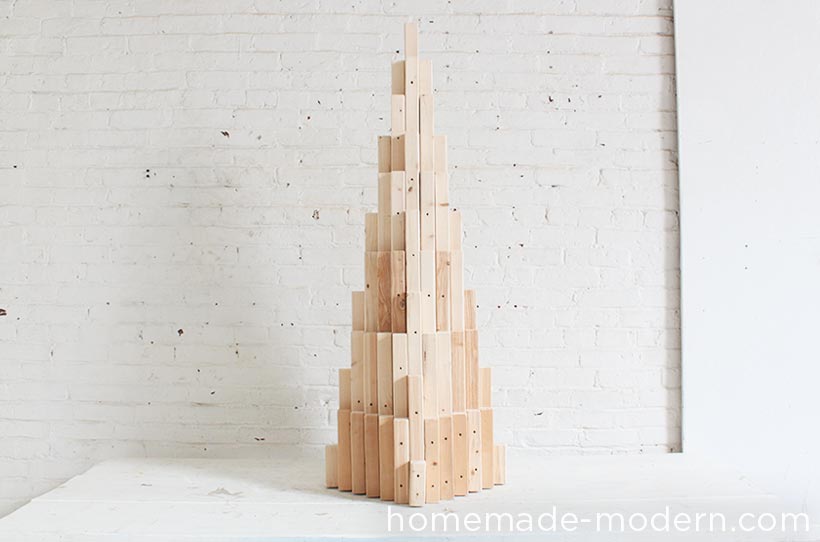 This 2x2 Xmas tree project puts a modern spin on holiday decorating. It’s easy to make with a few materials and repetitive steps. I like the natural wood look, but you can finish it off with paint or stain to match your style. For more information, go to HomeMade-Modern.com.