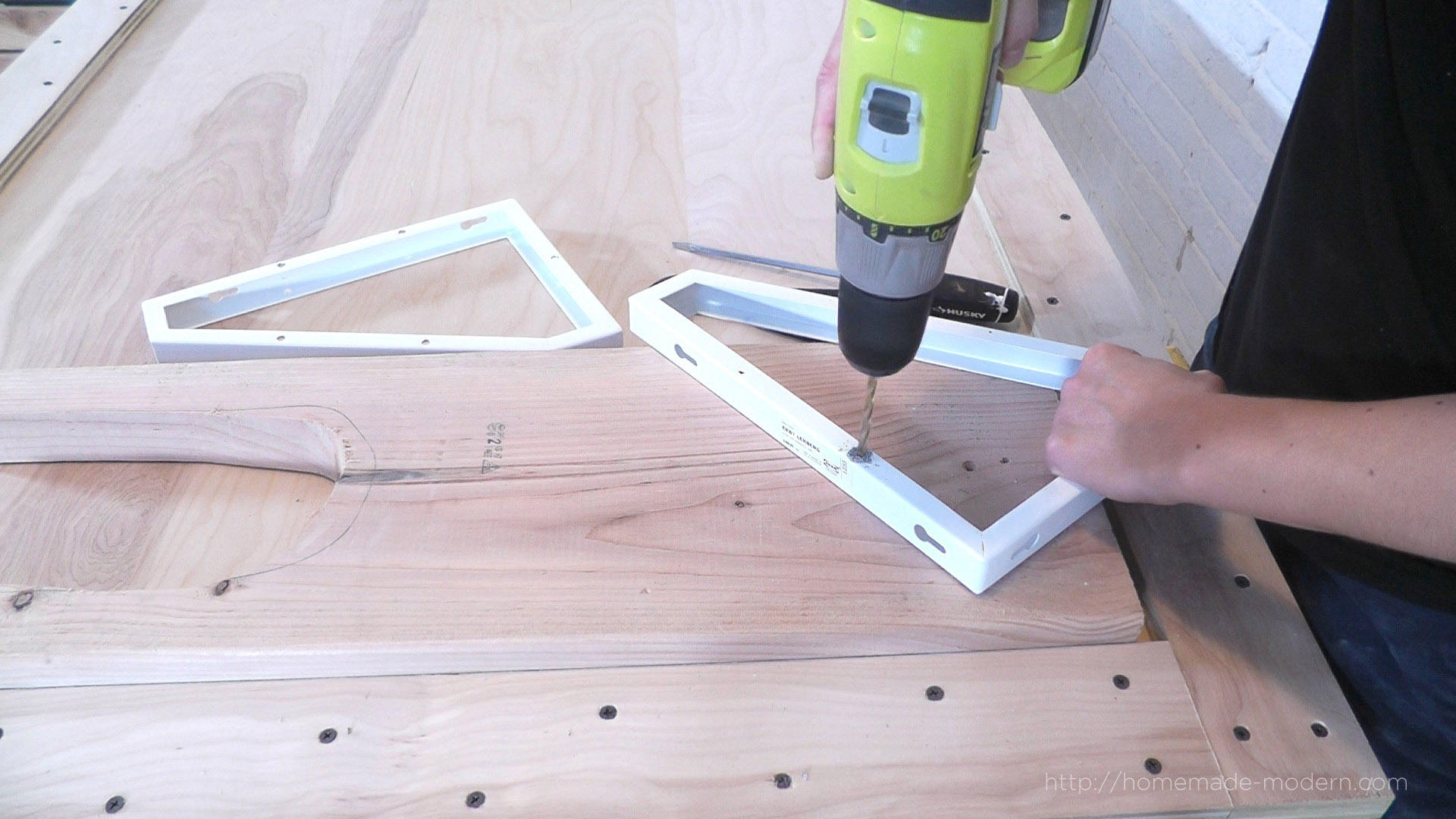 This DIY Modern Bed is made from a sheet of ¾” plywood, and 10 ikea shelf brackets. The materials cost  less than $100 and only 3 power tools are needed to build it. Full instructions can be found at HomeMade-Modern.com.