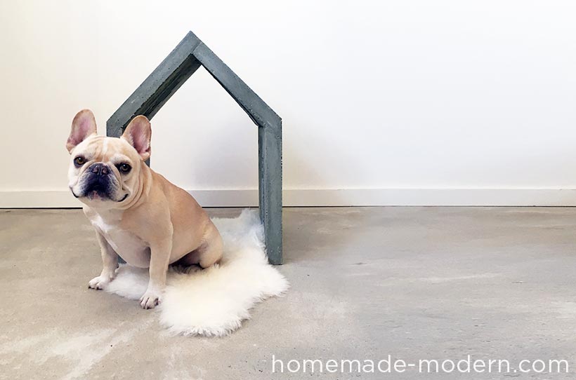 This modern concrete doghouse is made out of Quikrete Countertop Mix poured into a mold made out of 2x4s and Masonite. I poured the concrete in layers so that the weight of the wet concrete would not push the thin Masonite out. For full instructions go to HomeMade-Modern.com.