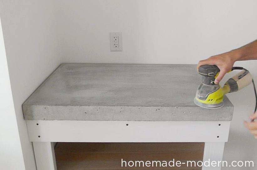 This concrete kitchen countertop was built for less than $120. The entire kitchen is a DIY project that costs less than $3500 for everything including appliances. There are three videos on the HomeMade Modern YouTube channel that show how to make the kitchen cabinets, concrete countertop and open shelving. For more information go to HomeMade-Modern.com.