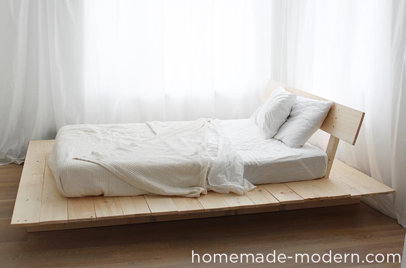 This DIY platform bed is made out of 2x8s, 2x4s and pine boards. I made this one for a full-sized mattress, but the design can be scaled up or down for different sized mattresses. This modern bed also has storage underneath it. For more information go to HomeMade-Modern.com.
